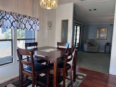 This 940 sq ft home offers an open floor plan and a bright on Lake Henry Golf Club in Florida - for sale on GolfHomes.com, golf home, golf lot