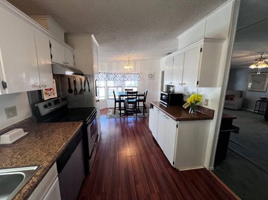 This 940 sq ft home offers an open floor plan and a bright on Lake Henry Golf Club in Florida - for sale on GolfHomes.com, golf home, golf lot