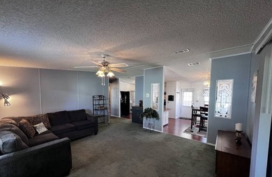 This 940 sq ft home offers an open floor plan and a bright on Lake Henry Golf Club in Florida - for sale on GolfHomes.com, golf home, golf lot