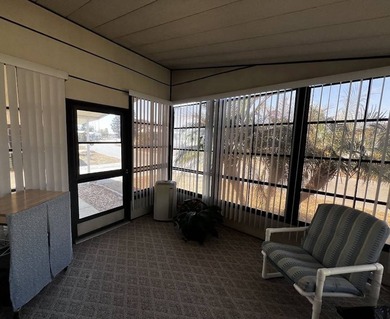 This 940 sq ft home offers an open floor plan and a bright on Lake Henry Golf Club in Florida - for sale on GolfHomes.com, golf home, golf lot