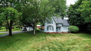 Discover the timeless charm of 9980 Tittabawassee, a historic on Golf Club At Apple Mountain in Michigan - for sale on GolfHomes.com, golf home, golf lot