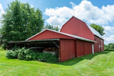 Discover the timeless charm of 9980 Tittabawassee, a historic on Golf Club At Apple Mountain in Michigan - for sale on GolfHomes.com, golf home, golf lot