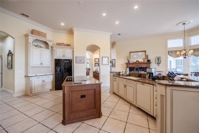 Welcome to 645 Whisper Woods Drive, a stunning estate located in on The Club at Eaglebrooke in Florida - for sale on GolfHomes.com, golf home, golf lot