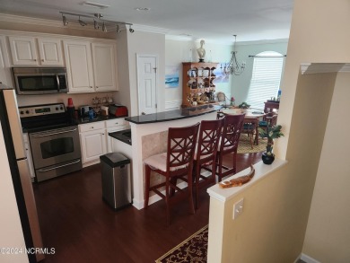 A beach getaway with three bedrooms PLUS an income producing on Sea Trail Golf Resort in North Carolina - for sale on GolfHomes.com, golf home, golf lot