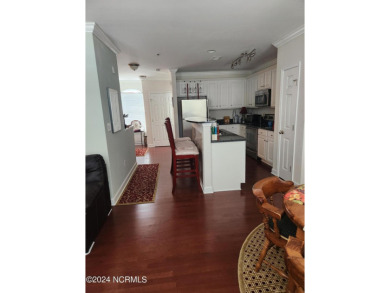 A beach getaway with three bedrooms PLUS an income producing on Sea Trail Golf Resort in North Carolina - for sale on GolfHomes.com, golf home, golf lot