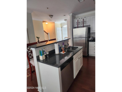 A beach getaway with three bedrooms PLUS an income producing on Sea Trail Golf Resort in North Carolina - for sale on GolfHomes.com, golf home, golf lot