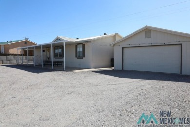 3-bedroom, 2-bath manufactured home on a large 0.67-acre lot in on Sierra Del Rio Golf Club in New Mexico - for sale on GolfHomes.com, golf home, golf lot