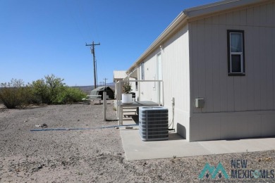 3-bedroom, 2-bath manufactured home on a large 0.67-acre lot in on Sierra Del Rio Golf Club in New Mexico - for sale on GolfHomes.com, golf home, golf lot