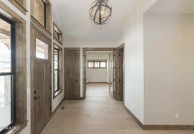 This stunning 3-bedroom ranch home offers breathtaking views on Grand Elk Ranch and Club in Colorado - for sale on GolfHomes.com, golf home, golf lot