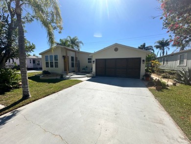 This 2 bedrooms, 2 bathrooms stucco home is being sold furnished on Del Tura Golf and Country Club in Florida - for sale on GolfHomes.com, golf home, golf lot