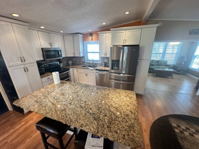 This 2 bedrooms, 2 bathrooms stucco home is being sold furnished on Del Tura Golf and Country Club in Florida - for sale on GolfHomes.com, golf home, golf lot