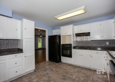 This Charming Two Story Cottage Is The Perfect Place To Call on Lake Forest Yacht and Country Club in Alabama - for sale on GolfHomes.com, golf home, golf lot