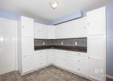 This Charming Two Story Cottage Is The Perfect Place To Call on Lake Forest Yacht and Country Club in Alabama - for sale on GolfHomes.com, golf home, golf lot