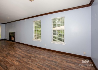 This Charming Two Story Cottage Is The Perfect Place To Call on Lake Forest Yacht and Country Club in Alabama - for sale on GolfHomes.com, golf home, golf lot