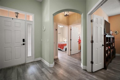 BOND PAID! STUNNING TURNKEY SOMERSET MODEL WITH GOLF CART on The Links of Spruce Creek in Florida - for sale on GolfHomes.com, golf home, golf lot