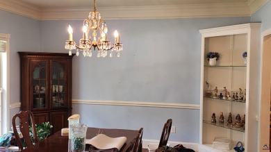 Discover this beautifully crafted 4-bedroom, all-brick home in on Landings Golf Club in Georgia - for sale on GolfHomes.com, golf home, golf lot