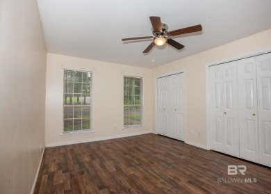 This Charming Two Story Cottage Is The Perfect Place To Call on Lake Forest Yacht and Country Club in Alabama - for sale on GolfHomes.com, golf home, golf lot