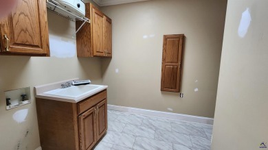 Discover this beautifully crafted 4-bedroom, all-brick home in on Landings Golf Club in Georgia - for sale on GolfHomes.com, golf home, golf lot