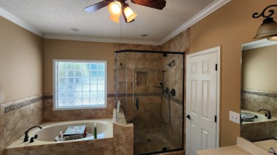 Discover this beautifully crafted 4-bedroom, all-brick home in on Landings Golf Club in Georgia - for sale on GolfHomes.com, golf home, golf lot