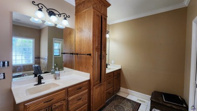 Discover this beautifully crafted 4-bedroom, all-brick home in on Landings Golf Club in Georgia - for sale on GolfHomes.com, golf home, golf lot