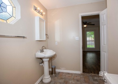 This Charming Two Story Cottage Is The Perfect Place To Call on Lake Forest Yacht and Country Club in Alabama - for sale on GolfHomes.com, golf home, golf lot