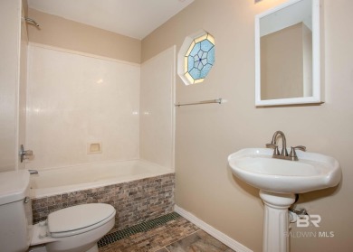 This Charming Two Story Cottage Is The Perfect Place To Call on Lake Forest Yacht and Country Club in Alabama - for sale on GolfHomes.com, golf home, golf lot