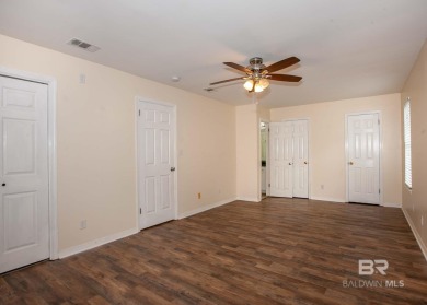 This Charming Two Story Cottage Is The Perfect Place To Call on Lake Forest Yacht and Country Club in Alabama - for sale on GolfHomes.com, golf home, golf lot