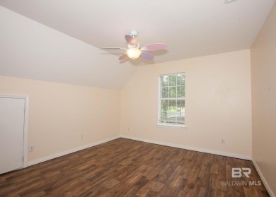 This Charming Two Story Cottage Is The Perfect Place To Call on Lake Forest Yacht and Country Club in Alabama - for sale on GolfHomes.com, golf home, golf lot