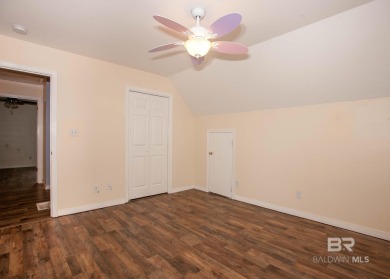 This Charming Two Story Cottage Is The Perfect Place To Call on Lake Forest Yacht and Country Club in Alabama - for sale on GolfHomes.com, golf home, golf lot