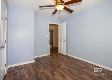 This Charming Two Story Cottage Is The Perfect Place To Call on Lake Forest Yacht and Country Club in Alabama - for sale on GolfHomes.com, golf home, golf lot