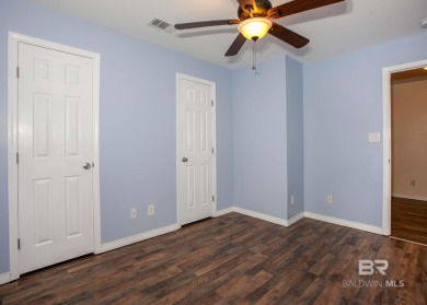 This Charming Two Story Cottage Is The Perfect Place To Call on Lake Forest Yacht and Country Club in Alabama - for sale on GolfHomes.com, golf home, golf lot