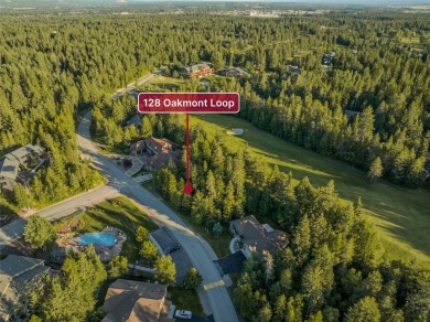 Nestled amongst tall pines overlooking the 6th green of the Golf on Meadow Lake Golf Resort in Montana - for sale on GolfHomes.com, golf home, golf lot