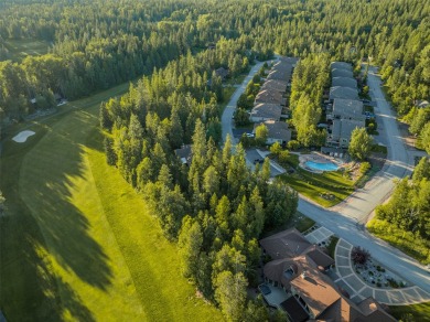 Nestled amongst tall pines overlooking the 6th green of the Golf on Meadow Lake Golf Resort in Montana - for sale on GolfHomes.com, golf home, golf lot