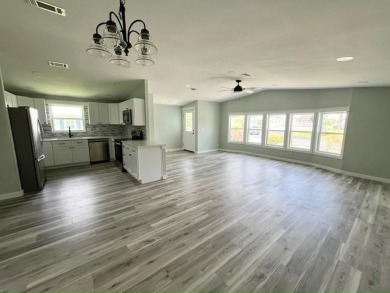 Beautifully renovated 2BD/2BA stucco home perfectly blends on Del Tura Golf and Country Club in Florida - for sale on GolfHomes.com, golf home, golf lot