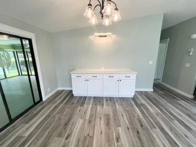 Beautifully renovated 2BD/2BA stucco home perfectly blends on Del Tura Golf and Country Club in Florida - for sale on GolfHomes.com, golf home, golf lot