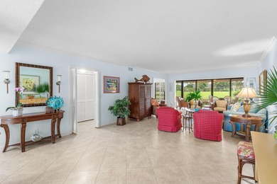 Wake up to tranquil lake and golf course views in this welcoming on Quail Ridge Golf Course and Country Club in Florida - for sale on GolfHomes.com, golf home, golf lot