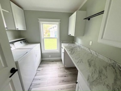 Beautifully renovated 2BD/2BA stucco home perfectly blends on Del Tura Golf and Country Club in Florida - for sale on GolfHomes.com, golf home, golf lot
