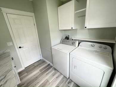 Beautifully renovated 2BD/2BA stucco home perfectly blends on Del Tura Golf and Country Club in Florida - for sale on GolfHomes.com, golf home, golf lot