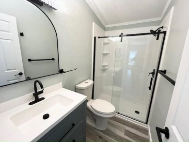 Beautifully renovated 2BD/2BA stucco home perfectly blends on Del Tura Golf and Country Club in Florida - for sale on GolfHomes.com, golf home, golf lot