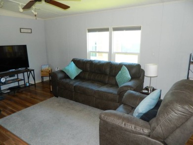 This 1984 Sherman home is 24x40 offering you 960 sq ft of open on Grasslands Golf and Country Club in Florida - for sale on GolfHomes.com, golf home, golf lot