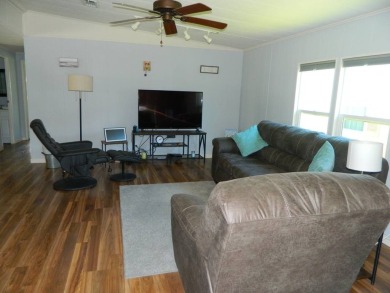 This 1984 Sherman home is 24x40 offering you 960 sq ft of open on Grasslands Golf and Country Club in Florida - for sale on GolfHomes.com, golf home, golf lot
