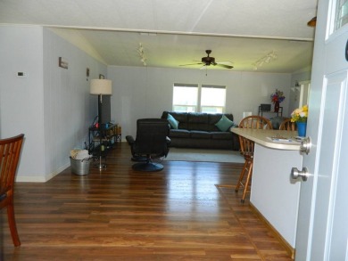 This 1984 Sherman home is 24x40 offering you 960 sq ft of open on Grasslands Golf and Country Club in Florida - for sale on GolfHomes.com, golf home, golf lot