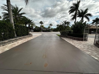 This stunning property is a masterpiece of elegance and on St. Lucie Trail Golf Club in Florida - for sale on GolfHomes.com, golf home, golf lot