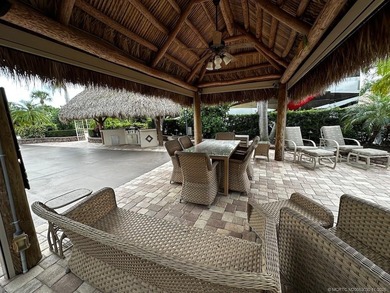 This stunning property is a masterpiece of elegance and on St. Lucie Trail Golf Club in Florida - for sale on GolfHomes.com, golf home, golf lot