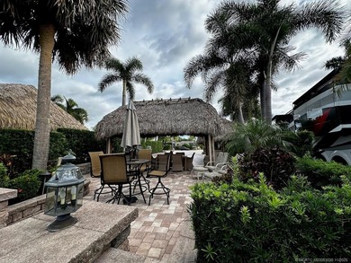 This stunning property is a masterpiece of elegance and on St. Lucie Trail Golf Club in Florida - for sale on GolfHomes.com, golf home, golf lot