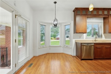 A beautifully updated brick home nestled on a peaceful corner on Kings Grant Golf and Country Club in North Carolina - for sale on GolfHomes.com, golf home, golf lot
