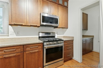 A beautifully updated brick home nestled on a peaceful corner on Kings Grant Golf and Country Club in North Carolina - for sale on GolfHomes.com, golf home, golf lot