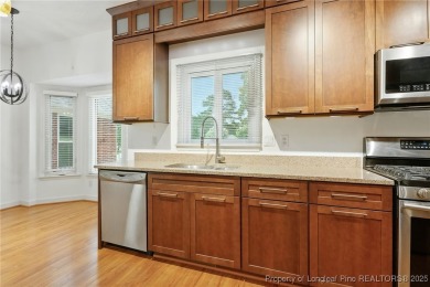 A beautifully updated brick home nestled on a peaceful corner on Kings Grant Golf and Country Club in North Carolina - for sale on GolfHomes.com, golf home, golf lot