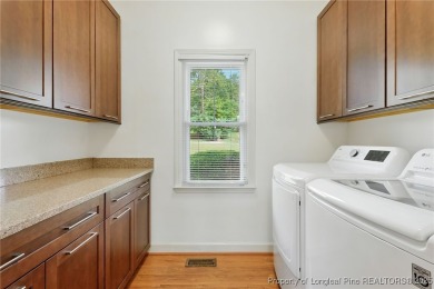 A beautifully updated brick home nestled on a peaceful corner on Kings Grant Golf and Country Club in North Carolina - for sale on GolfHomes.com, golf home, golf lot