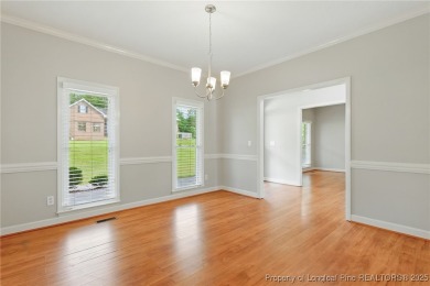 A beautifully updated brick home nestled on a peaceful corner on Kings Grant Golf and Country Club in North Carolina - for sale on GolfHomes.com, golf home, golf lot